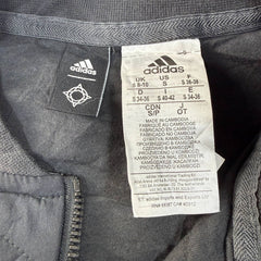 Adidas black quilted sleeveless vest with half zip